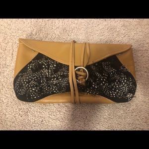 Clutch feathered with wrap closure